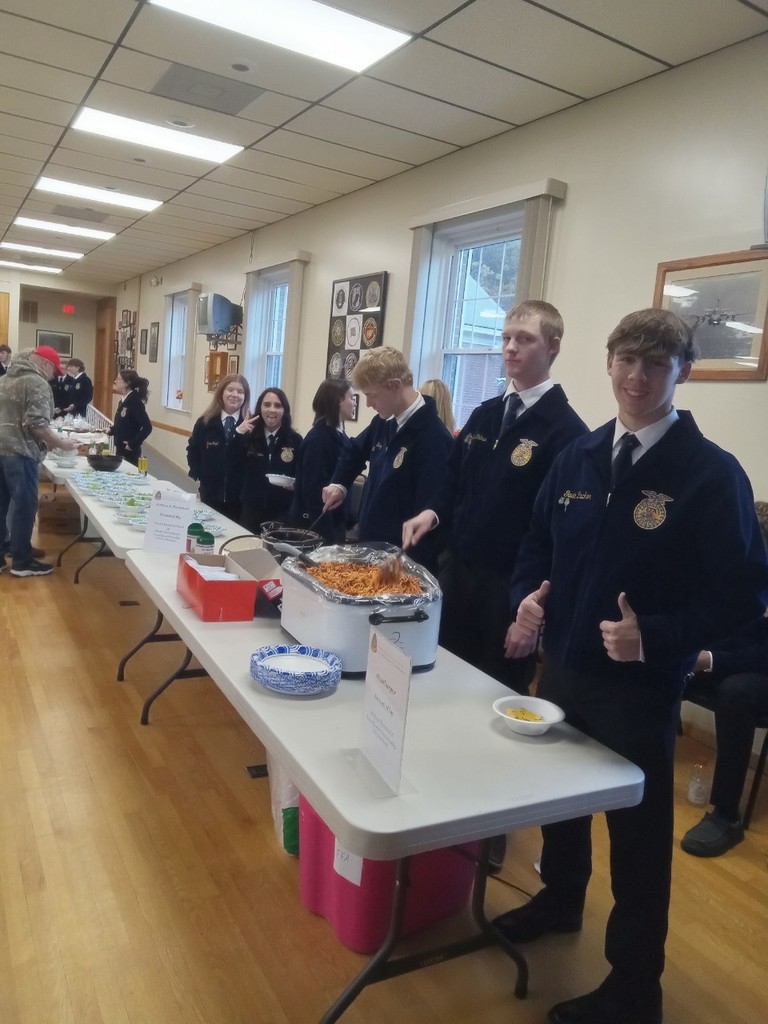 FFA members helping serve spaghetti. 