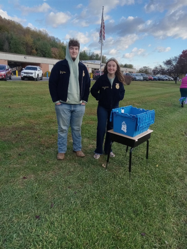 FFA members Janine Hartman and Chris Stadler handing out candy at the pumpkin patch.
