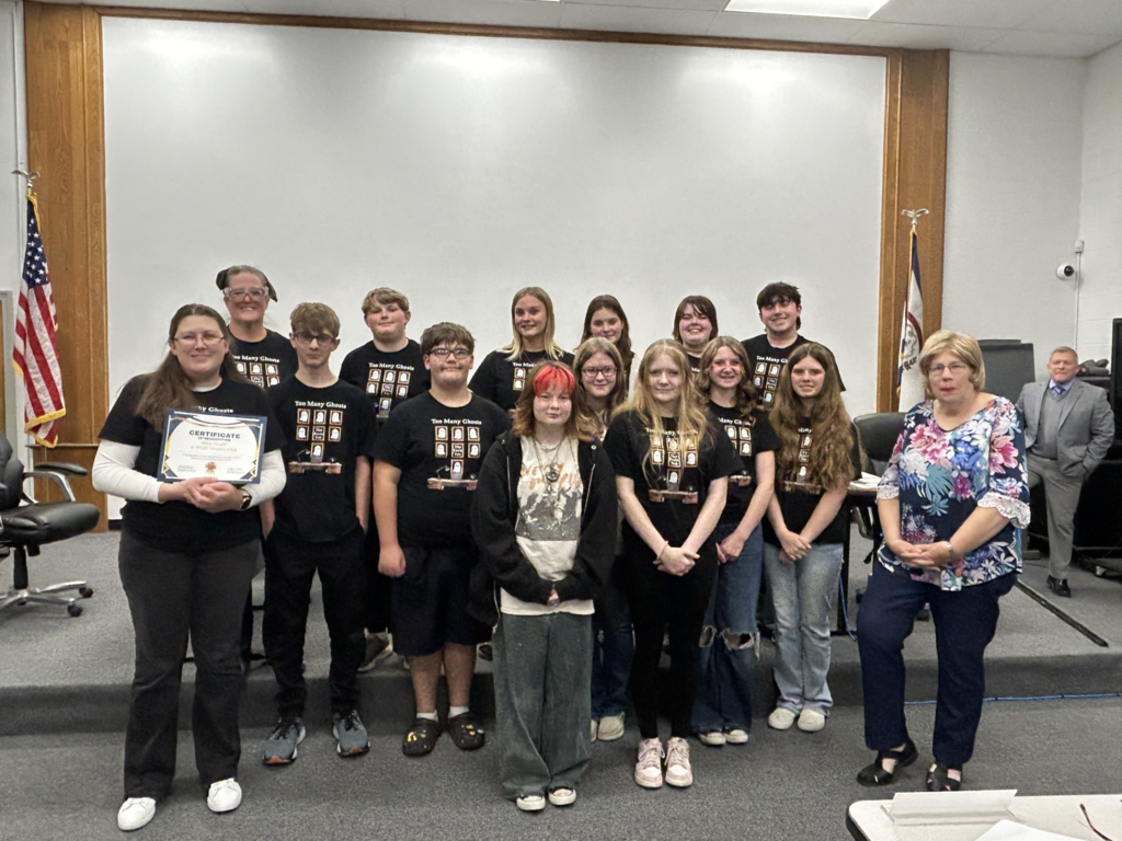 A group of students receiving an award.