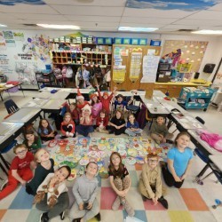 Group of students sitting in a circle in their classroom.