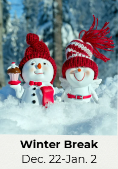 Two smiling snowmen in red winter hats and scarves in the snow.