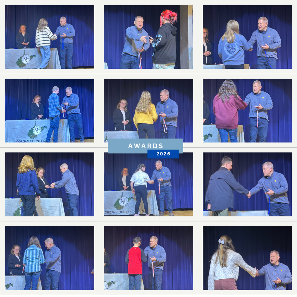 Superintendent presenting awards to science fair winners. 