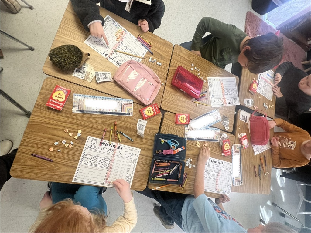 student desks with crayons and papers