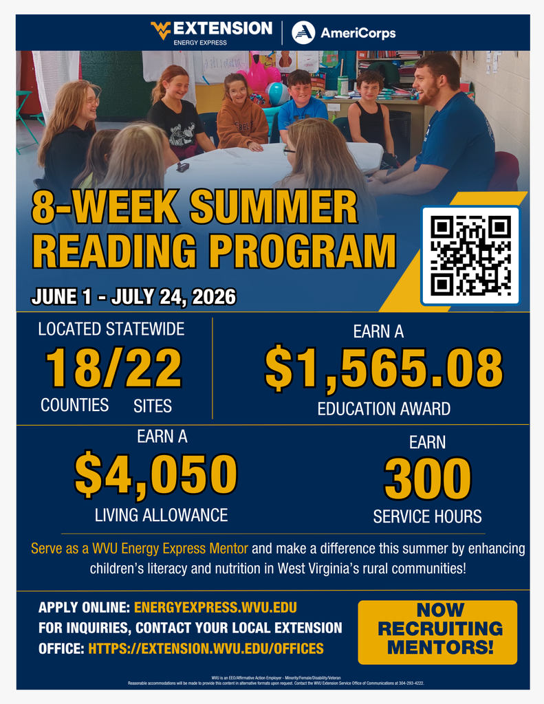 Students and mentor sitting at a table during a summer reading program.