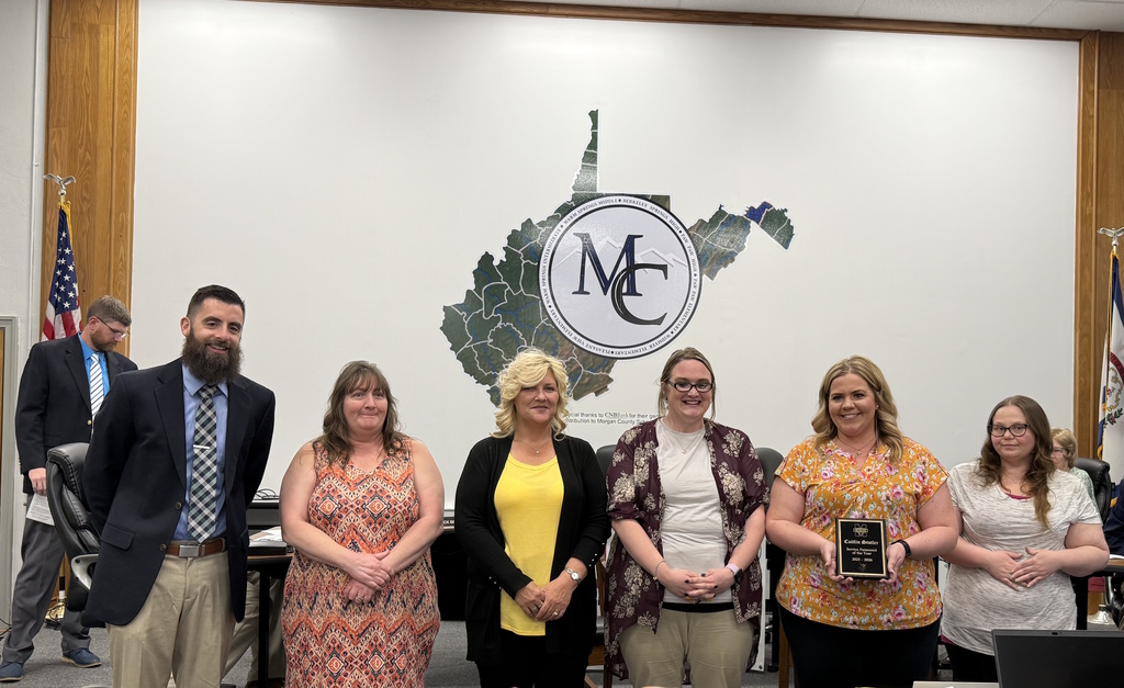 Board Member with 5 staff members nominated for MC Service Personnel of the Year.