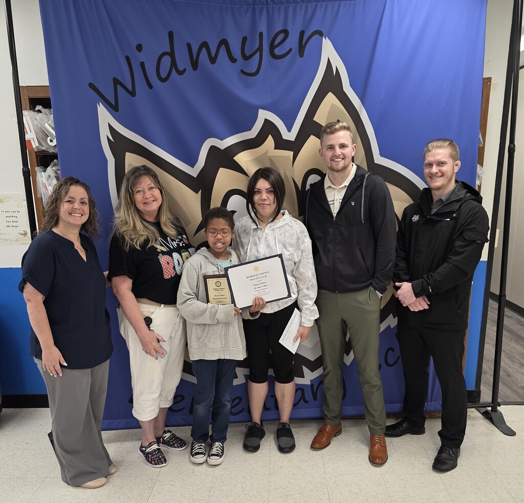 Pictured is our most improved second grade student, her teacher, her mother, and 3 members from the Rotary club, who presented her with an award. 