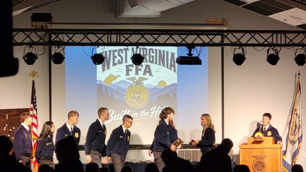Parliamentary Procedure Team receiving plaque for first place at regionals. 