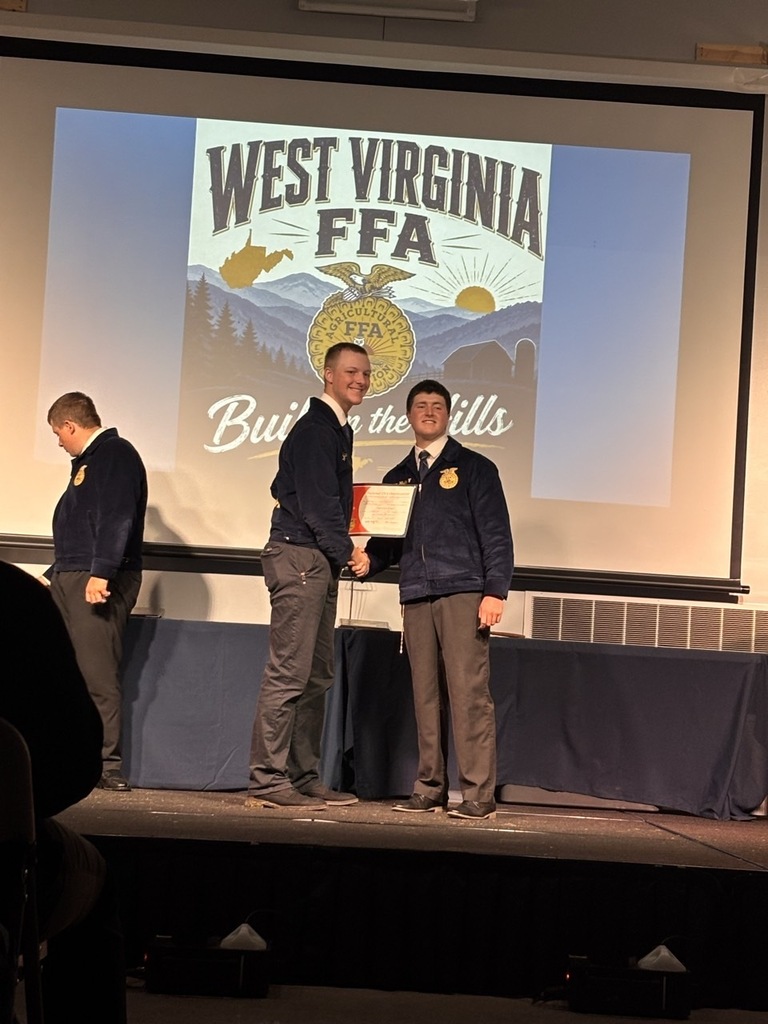 Josh Columus receiving his State FFA Degree