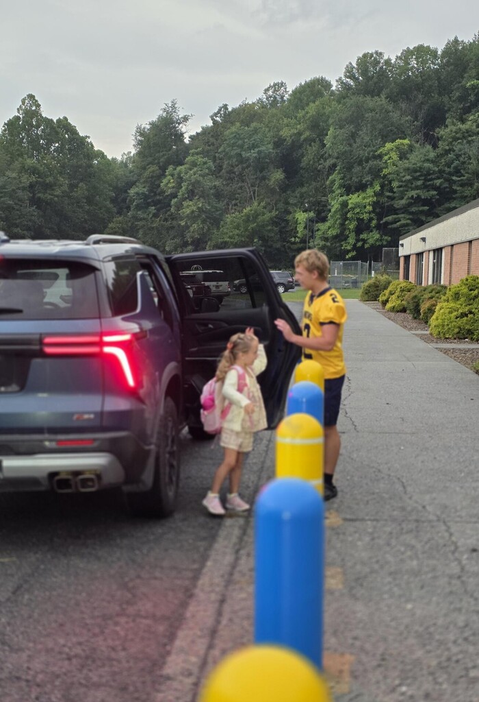 These are pictures of high school students opening car doors and greeting students.