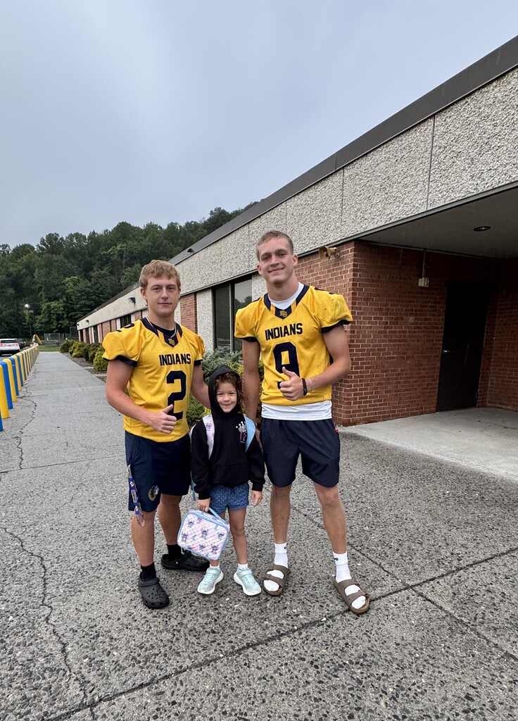 These are pictures of high school students opening car doors and greeting students.