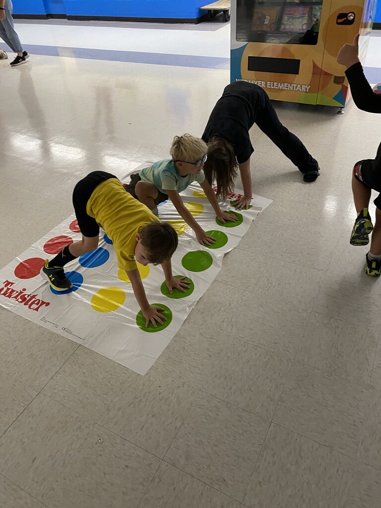Kids playing a large board game