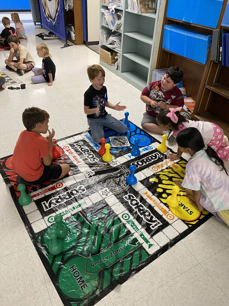 Kids playing a large board game