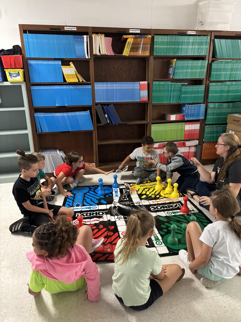 Kids playing a large board game