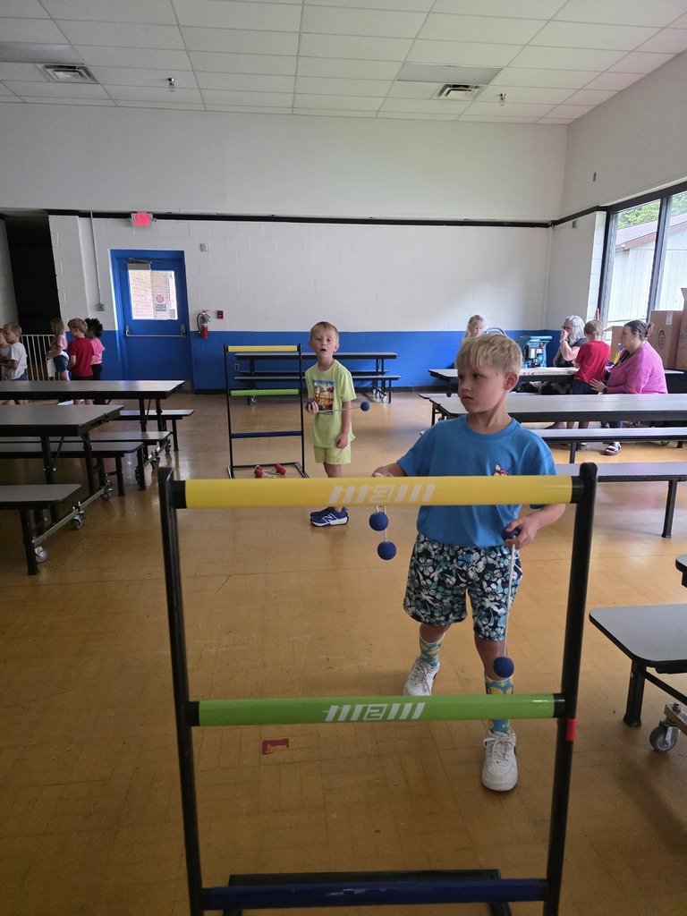 Kids playing ladder ball