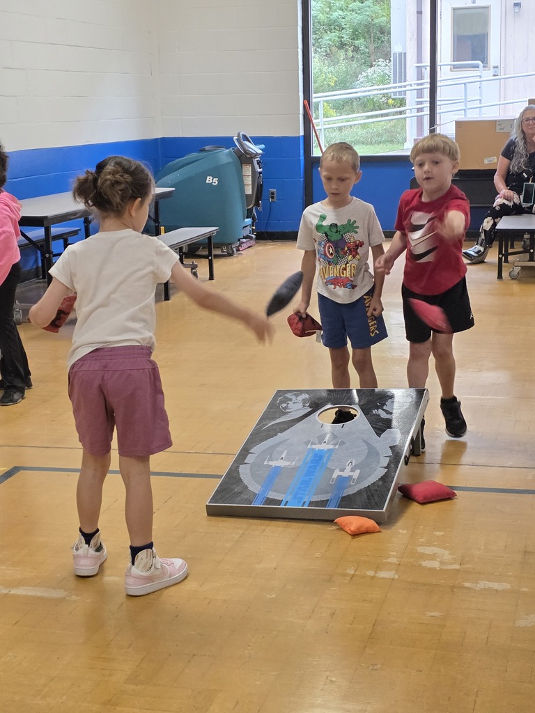 Kids playing cornhole