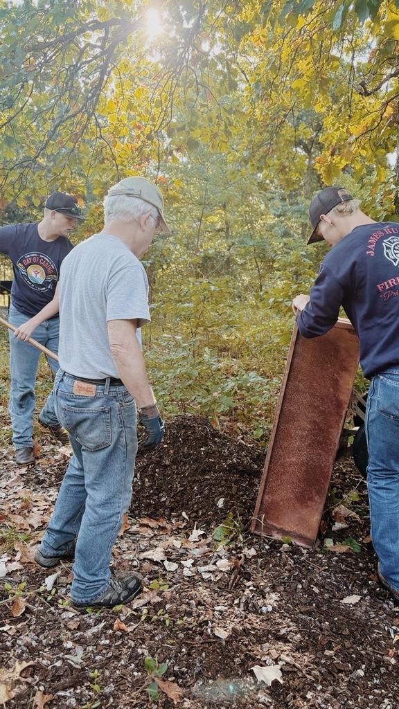 FFA members and Warms Springs Watershed members dumping mulch to forrest floor