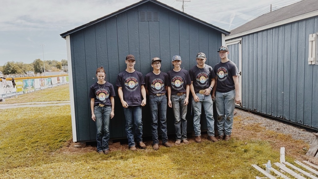 Group of members smiling for a group photo