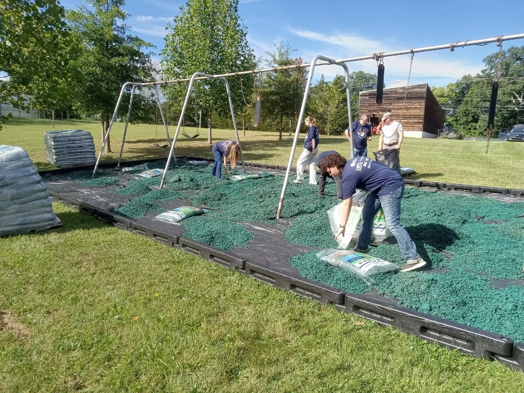 FFA Students spreading mulch at the playground