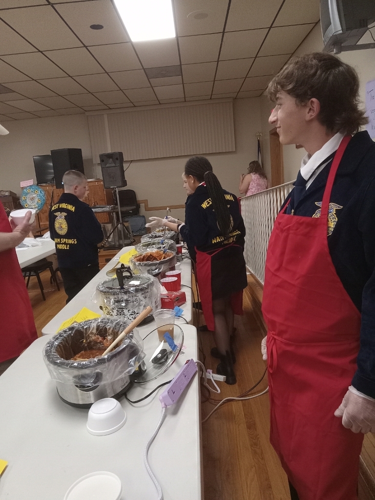 members standing in stations to serve soup