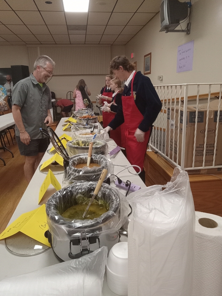 members chat with man while serving him