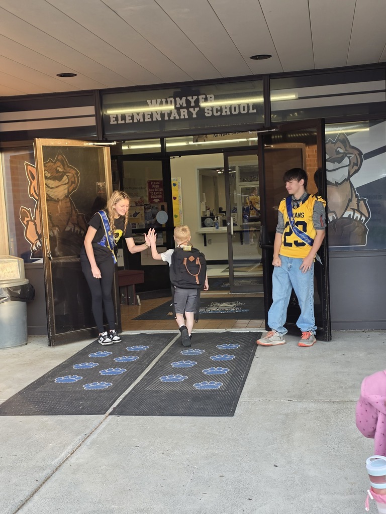 These are pictures of high school students opening car doors and greeting students.