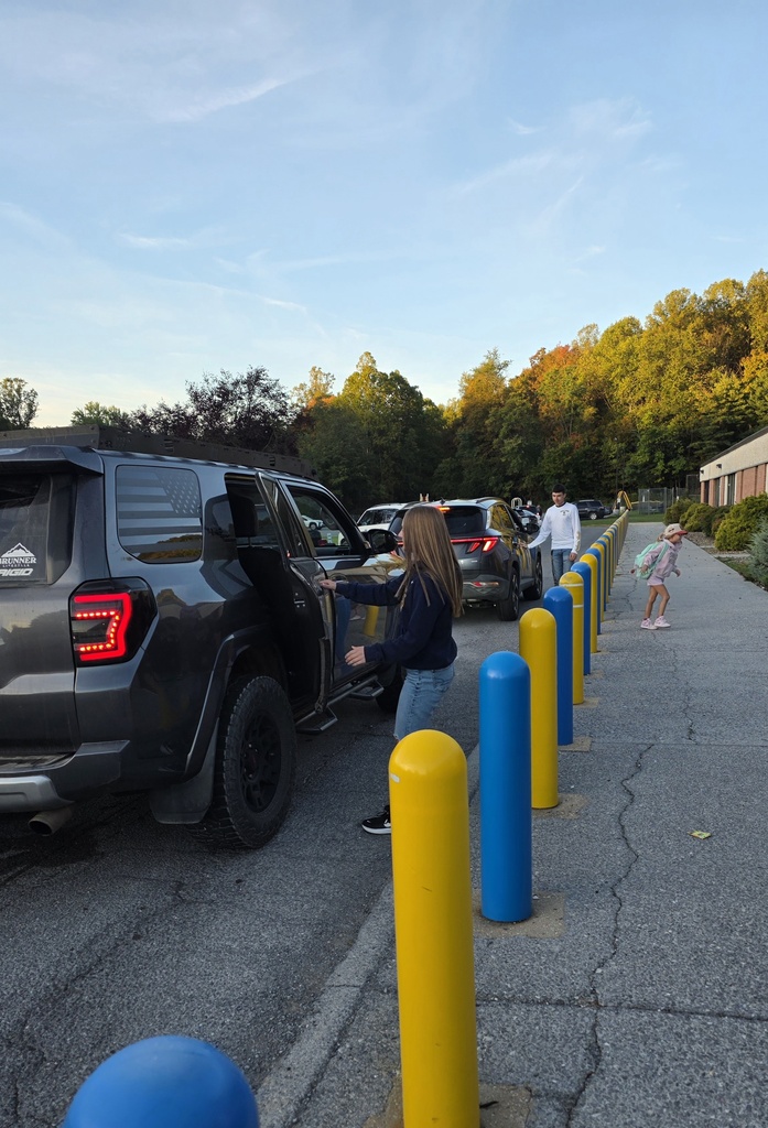 These are pictures of high school students opening car doors and greeting students.
