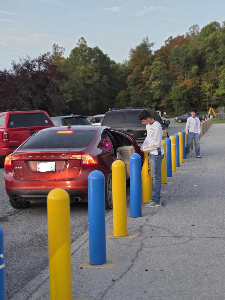 These are pictures of high school students opening car doors and greeting students.