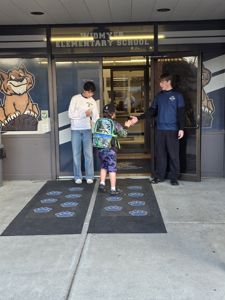These are pictures of high school students opening car doors and greeting students.