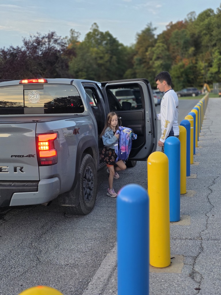 These are pictures of high school students opening car doors and greeting students.