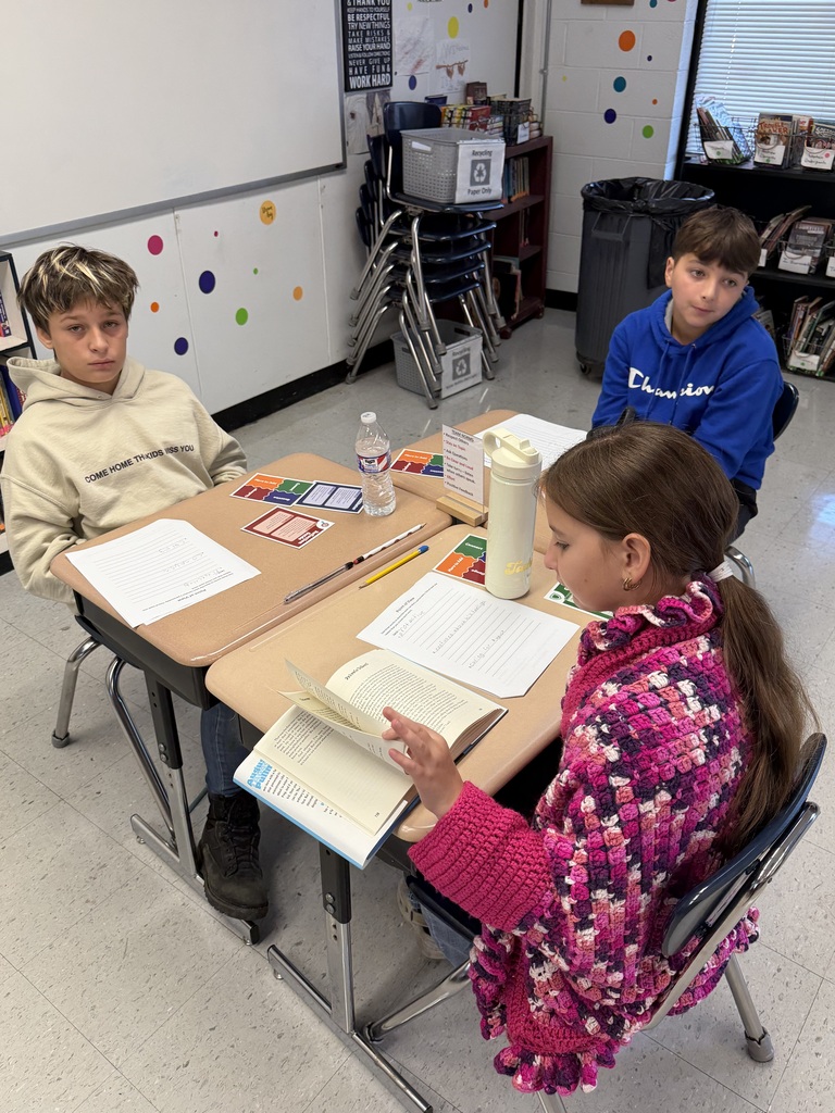 Students collaborate on Wonder, sharing ideas and supporting their thinking with textual evidence.