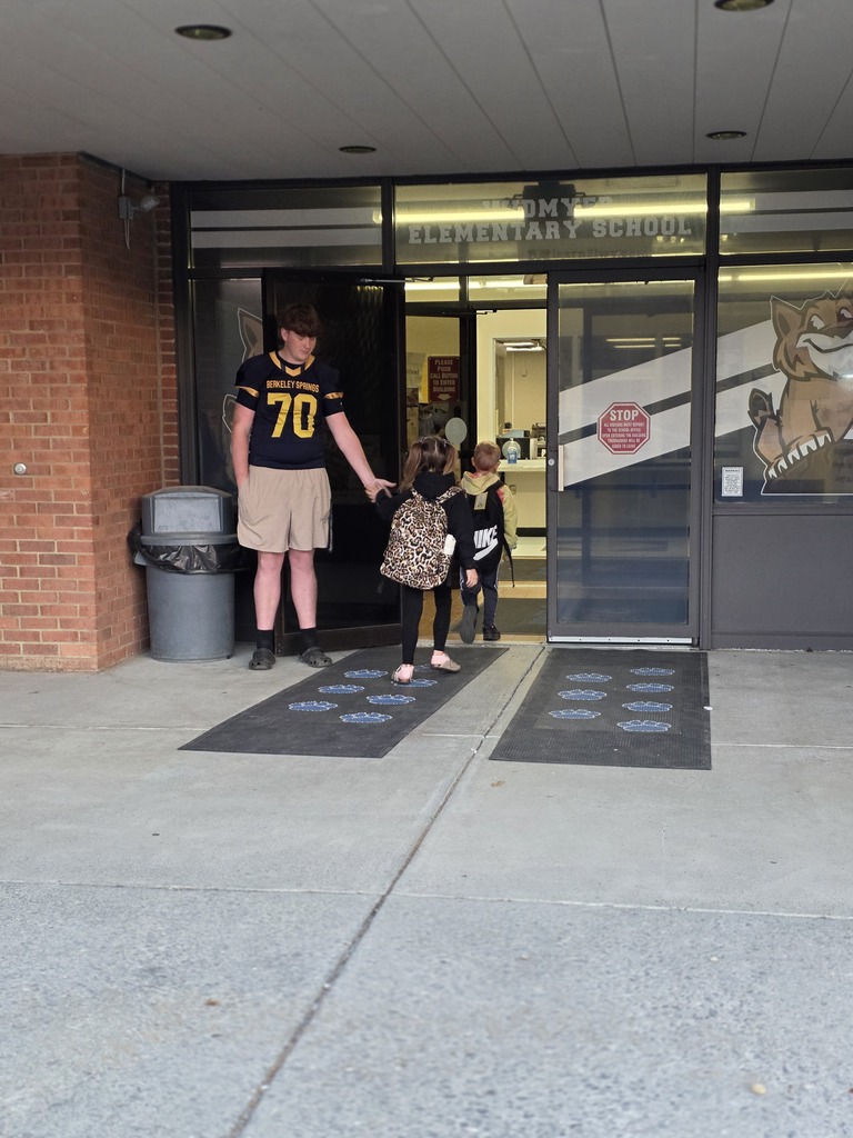 These are pictures of high school students opening car doors and greeting students.