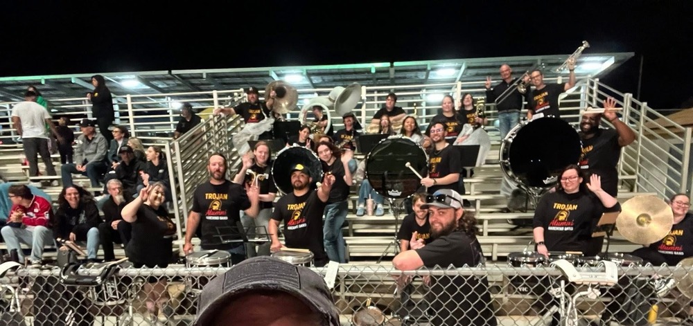 Members of the Trojan Alumni Marching Band pose during performances at the home football game Friday, September 26 at Trojan Stadium.