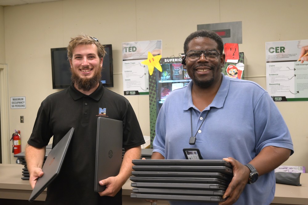 photo of it distributing laptops
