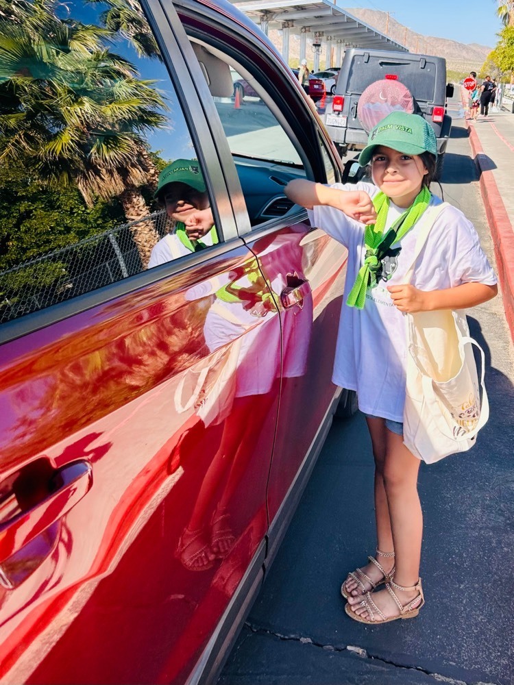 Student Leadership student Pebbles Garcia handing out swag at the car wash