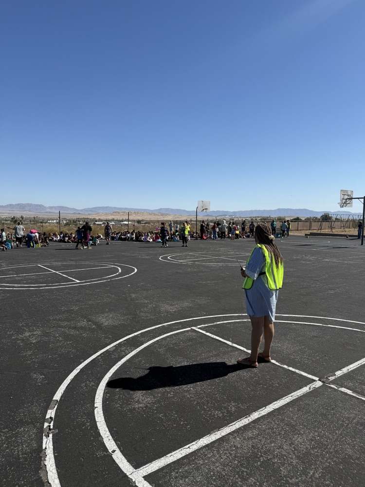 Principal Dr. Onumah watching over her school during Earthquake drill