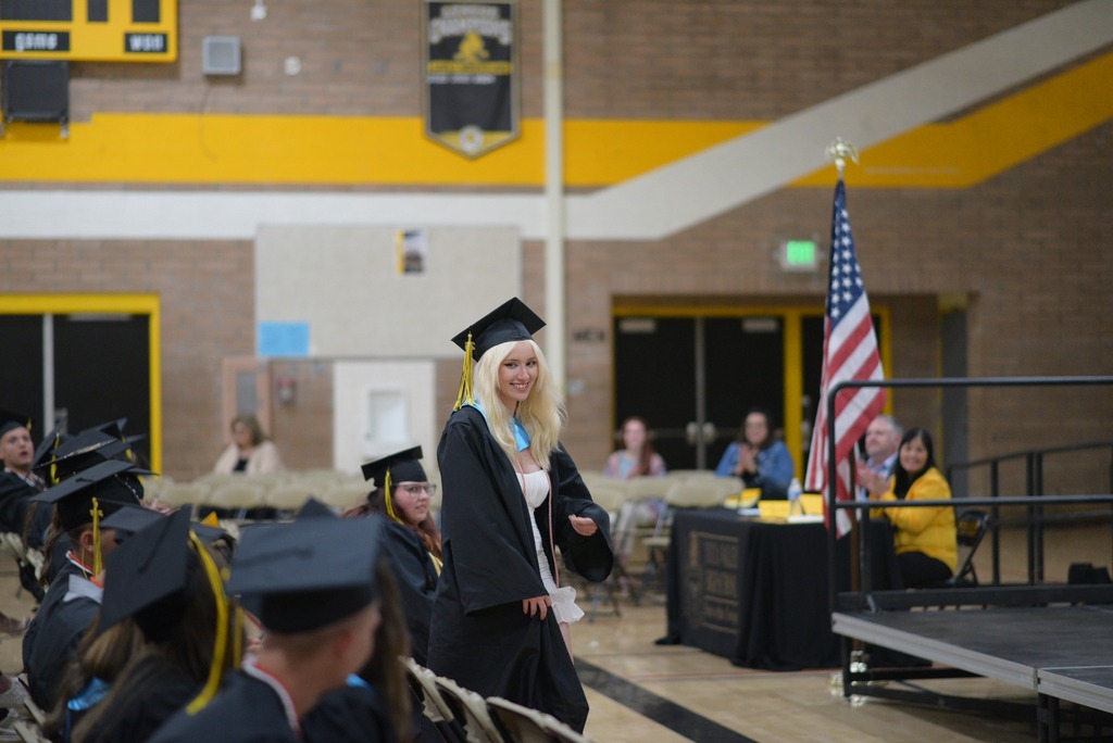 student walking to stage