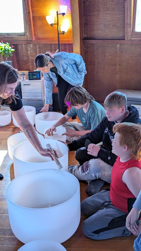 Students at PLUS participate in a sound bath