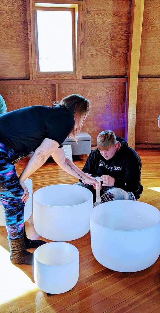 Students at PLUS participate in a sound bath