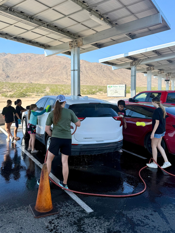 Ms. St. Martin and student leaders washing cars