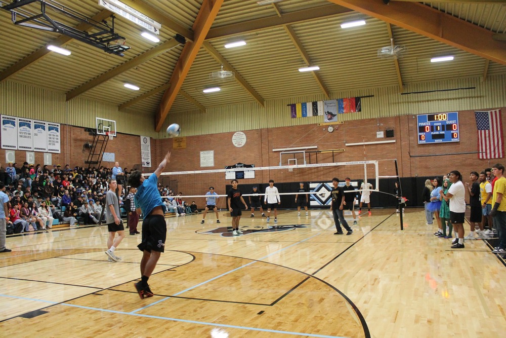 RHS senior makes a serve during the semi-final Macho Volleyball game