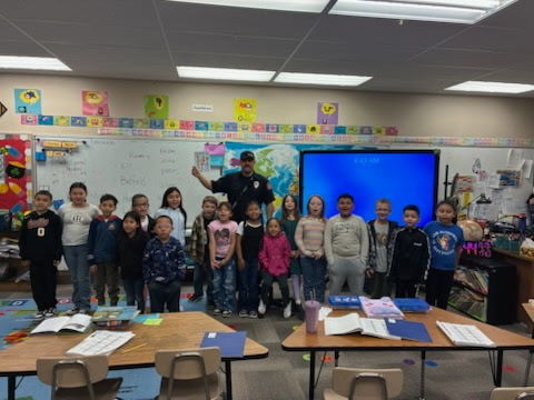 kids with a firefighter for reading