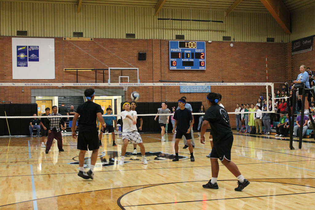 Riverside HS Junior prepares to bump ball during Macho Volleyball game against the Senior class