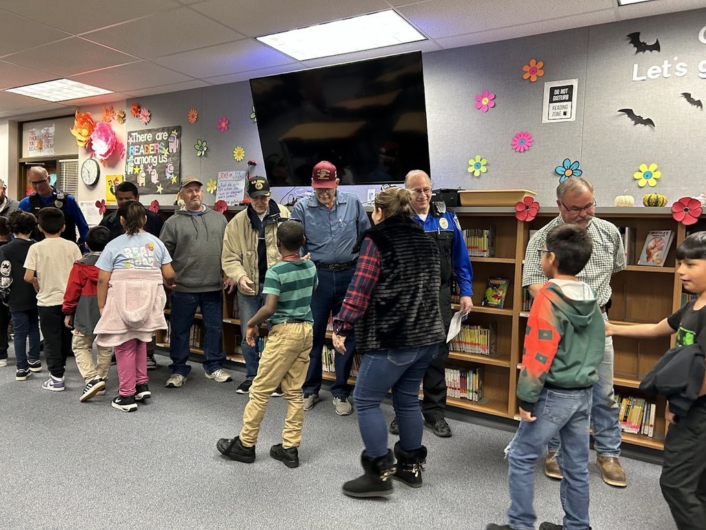 3rd Graders shake hadnds with Veterans