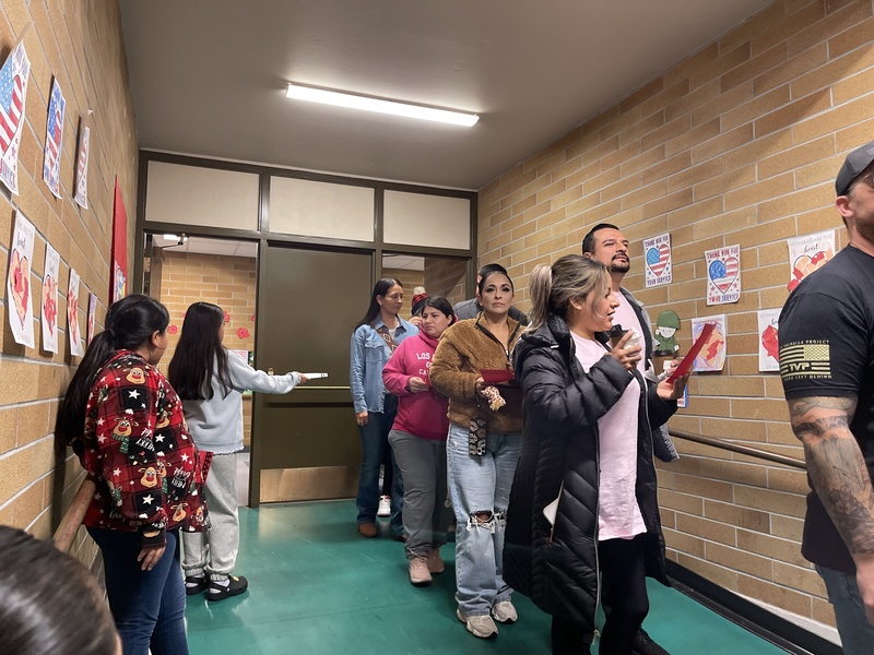 Students giving out programs