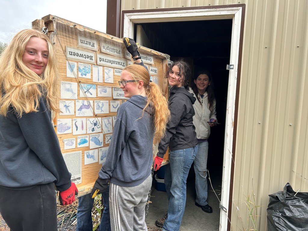 Environmental Club members fixing a display at Phillips Farm!