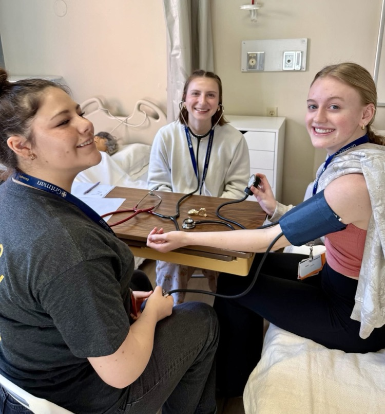student taking blood pressure