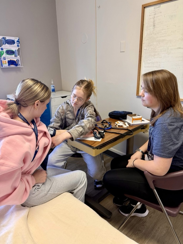 student taking blood pressure