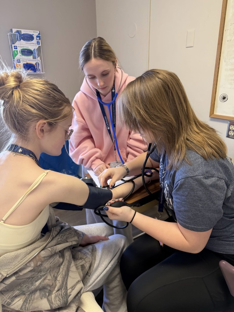 student taking blood pressure