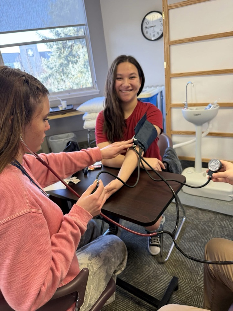 student taking blood pressure