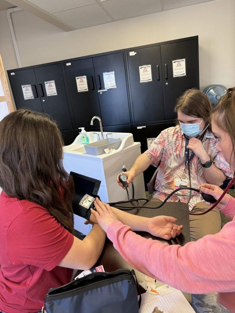 student taking blood pressure